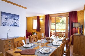 Enjoy a delicious meal around the dining table.