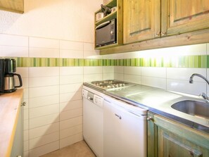 Prepare a meal in the equipped kitchen.