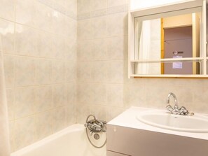 Freshen up in the bathroom after a day of adventure.