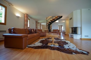 Find peace and relaxation with your close friends and family in this cozy living room.