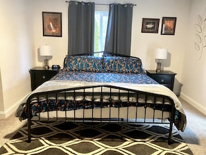 Master bedroom on main level. King bed medium/soft. 