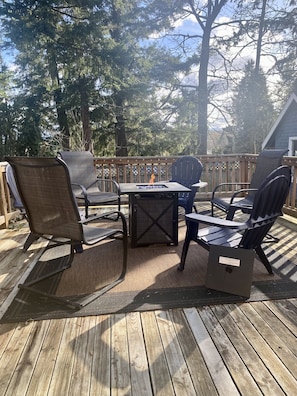 Firepit with seating for 6 on back porch. 