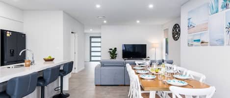 An open-plan kitchen and dining space on the ground floor offers a bright and welcoming space to relax. 
