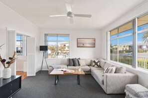 An oversized sofa upstairs encourages guests to get comfortable in the evenings, with a glass of wine and a good book.
