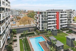 The north facing balcony looks over the communal pool area. Laps in the pool is the perfect alternative for when the beach is busy or to enjoy some aquatic exercises. 
