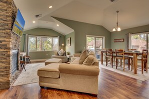 Living area with comfy couch, flat-screen TV, and gas fireplace