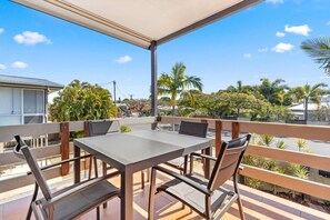 Enjoy a morning cuppa or glass of wine at sunset on the balcony, with leafy views overlooking the palm trees.  