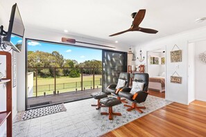 The lounge area opens directly to the balcony creating a lovely transition with the outdoors.
