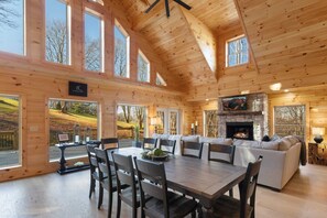 Vaulted Tongue and Groove Ceilings, Wood Floors, and Wall of Windows