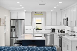 Gorgeous kitchen with marble island and open layout