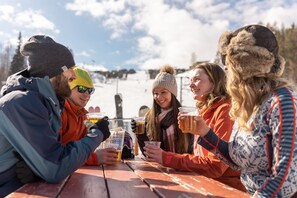 Apres ski festivities on the sunny village plaza