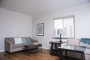 Living room with two sofas and an HD TV.