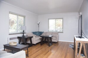 Living room with two sofas and an HD TV.