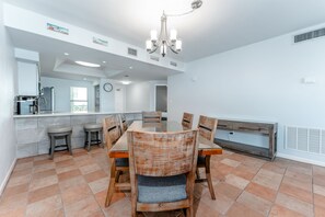 Dining is easy and comfortable at the table along with a dinner bar, with seating for 4 extra guest.. 