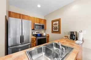 Full kitchen with stainless steel appliances
