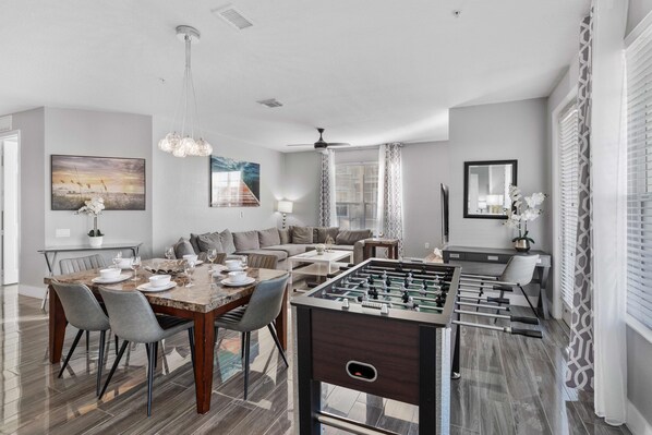 Experience the ultimate blend of relaxation and entertainment in the living room, complete with a thrilling foosball table.