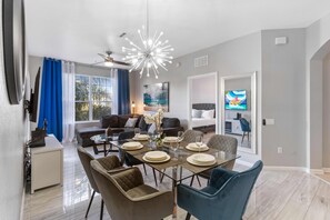 The living room at Vista Cay Resort is the epitome of comfort and style, offering guests a cozy retreat where they can unwind, socialize, and enjoy quality time together amidst the inviting ambiance of Orlando's premier resort destination.