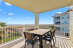 Outdoor dining with beach crossover just outside your door.