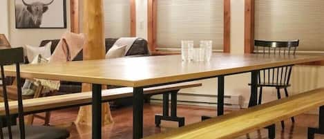 Large dining table that comfortably seats 10. 
