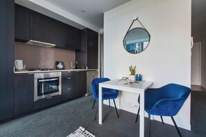 Open plan living allows you to cook up a meal and relax and at the table complete with velvet chairs