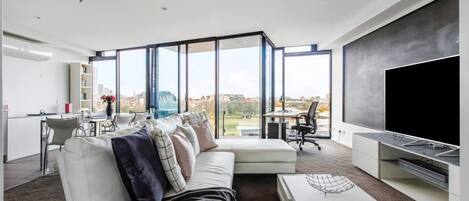 The living room is open plan and spacious, creating a relaxing space for couples or solo travellers.