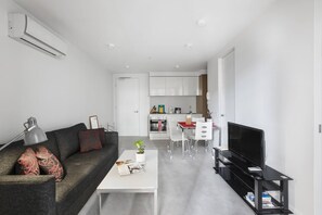 The spacious living area offers a comfortable place to kick up your feet after exploring all the city has to offer