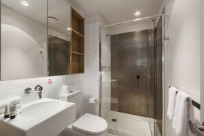 The ultra-modern bathroom with walk-in shower, mirrored cabinet and plenty of storage for your personal belongings