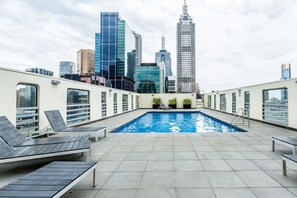 Soak up the scenic Melbourne views and catch some sunny rays at the luxurious rooftop communal pool 