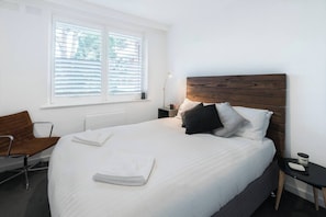 The second bedroom is also beautifully presented with a wardrobe for your belongings and side tables. 