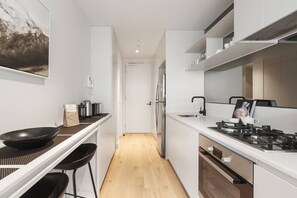 Make use of the galley kitchen complete with a breakfast bar, stainless steel appliances and plenty of bench space to whip up a home cooked meal 