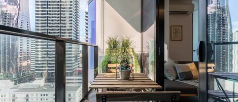 Step out of the large sliding glass doors and onto your private furnished balcony where you can enjoy a cup of coffee with views of the CBD