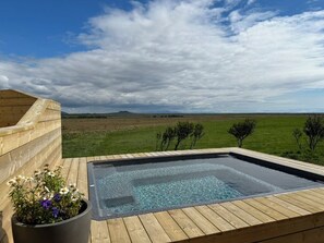 The hot tub on a nice summer day. 