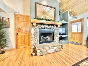 The natural stone wood fireplace is both beautiful and functional!