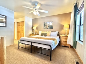 King bed with NEW mattress for a restful night sleep.
