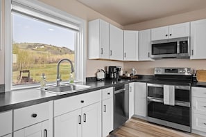 Full sized kitchen. You never know what kind of wildlife you'll see out of this gorgeous window.