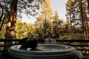 Wind down from the day in your private hot tub on the deck.