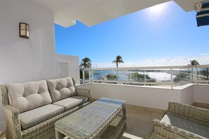 Outdoor seating area for three guests in the south facing balcony with sea views