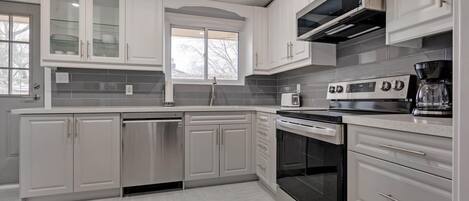 Fully stocked stainless steel kitchen