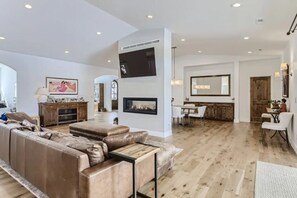 Comfy, informal living room with fireplace.