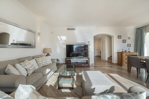 Our living space has Smart TV and two large sofas, a long mirror for more light (1)