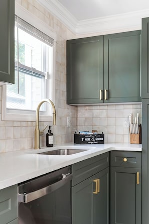 Fully stocked with added appliances: blender, air fryer, toaster & crock pot.