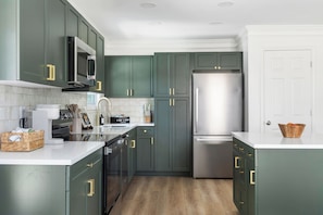 Fully stocked with added appliances: blender, air fryer, toaster & crock pot.