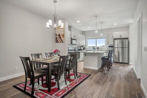 Dining Area with Kitchen Island and Bar Stools