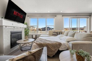 Beautiful cozy sofa bed with 65" Smart TV with Netflix to enjoy your favourite shows, movies  and more!