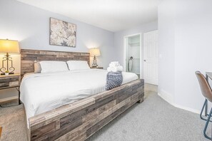 A luxurious king bed paired with a convenient work station - ideal for both rest and productivity.