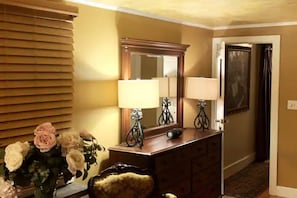 King size bed in Master Bedroom with antiques.
