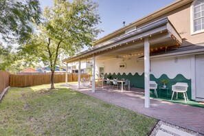 Covered Patio | Outdoor Dining Area | Lounge Seating | Fenced Yard