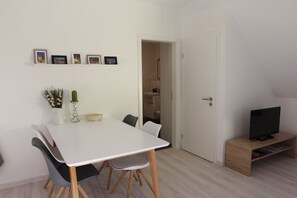 Dining table with space for 4 people - a children's high chair is also available.