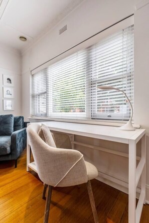 A desk makes it easy to catch up on work during your stay.