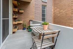 Enjoy the outdoors from your private balcony that comes furnished with a small table for two.
